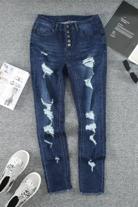 HIGH RISE RIPPED JEANS